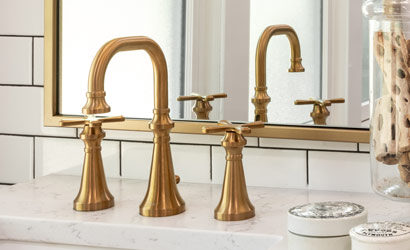 Brass faucet in bathroom